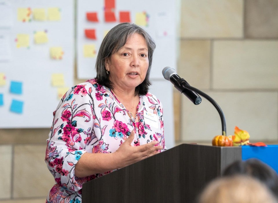 Prof. Margarita Jimenez-Silva speaks at podium
